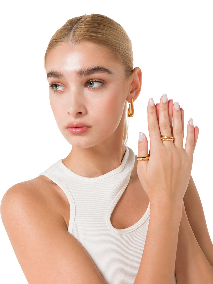 ALALYA gold sculptural textured multi-band ring styled on hand – luxury women’s jewelry UAE
