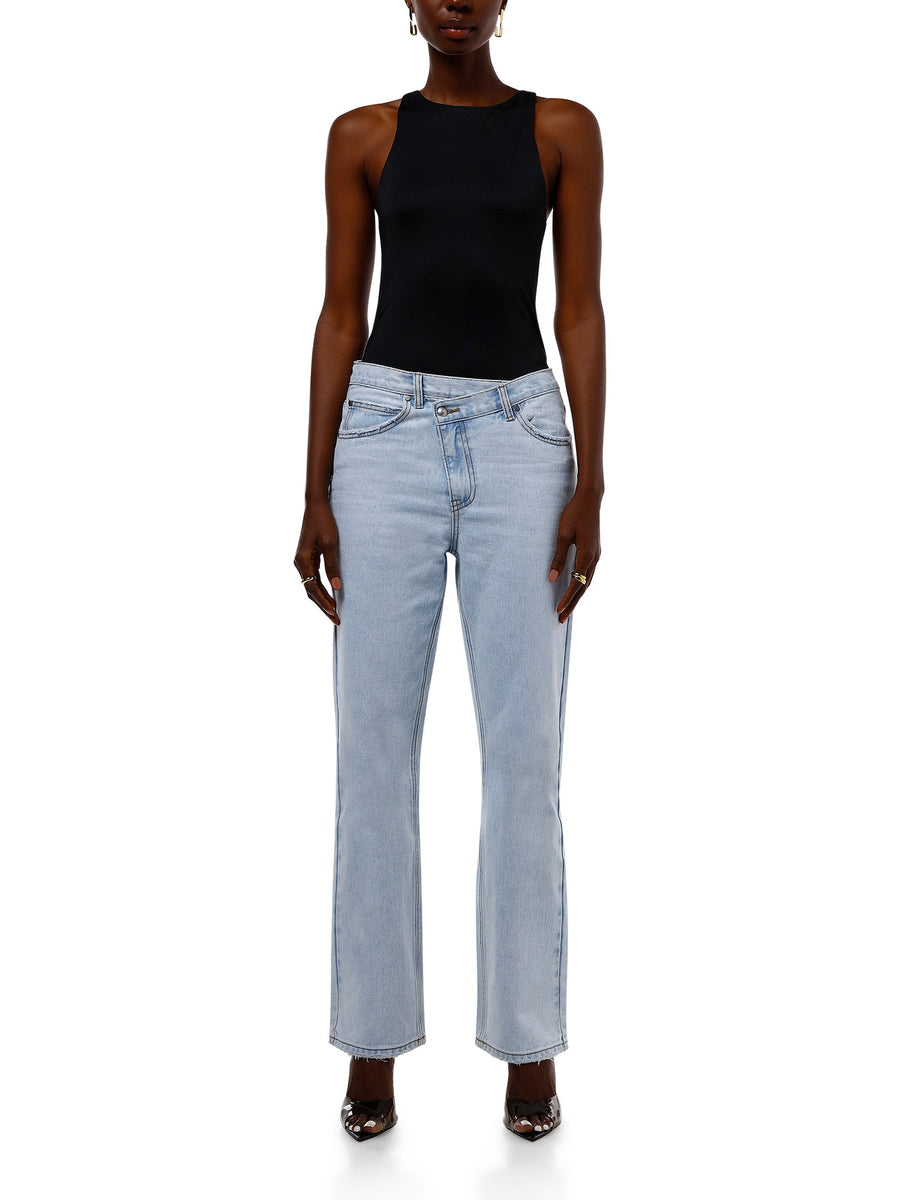 ALT Text: ALALYA Marina™ mid-rise blue straight-leg jeans styled with black top – UAE