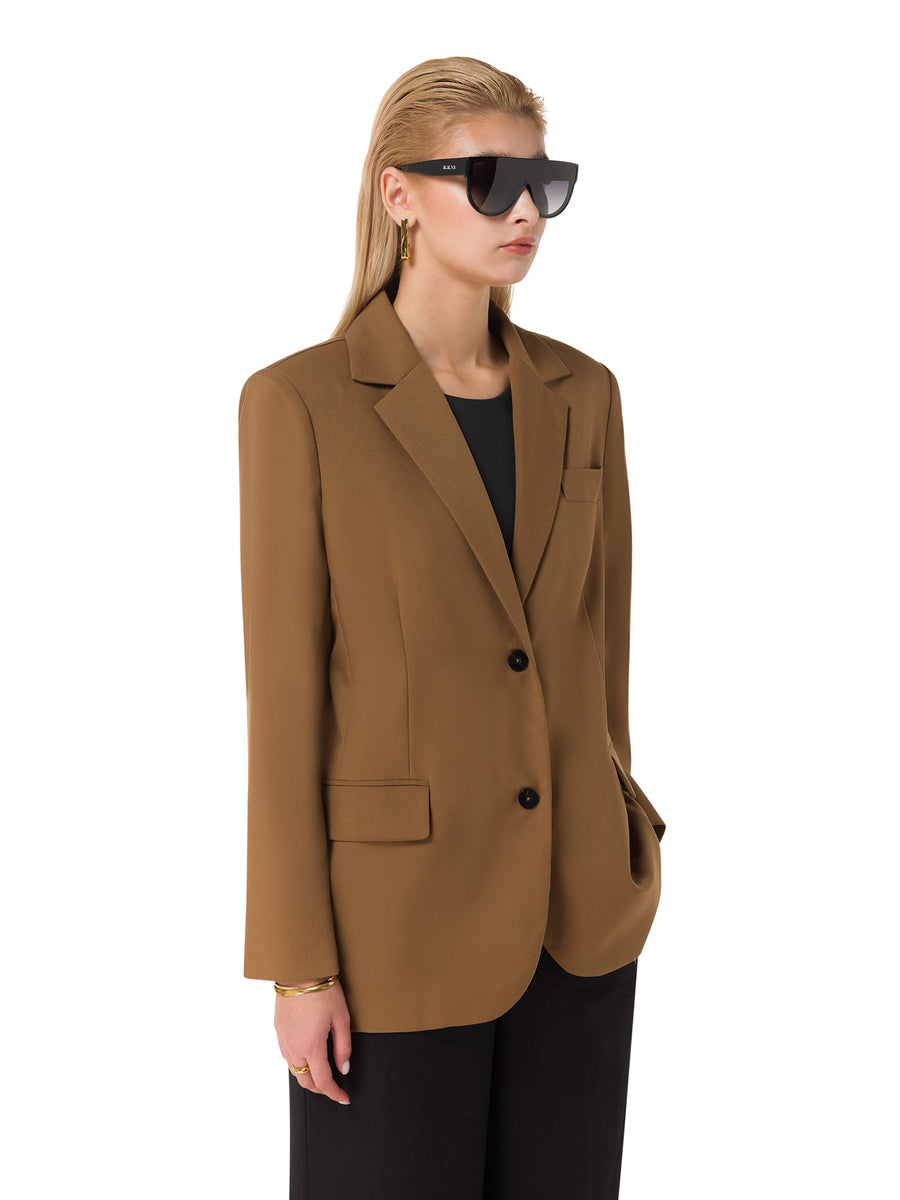 Side view of tailored brown blazer – power dressing fashion UAE