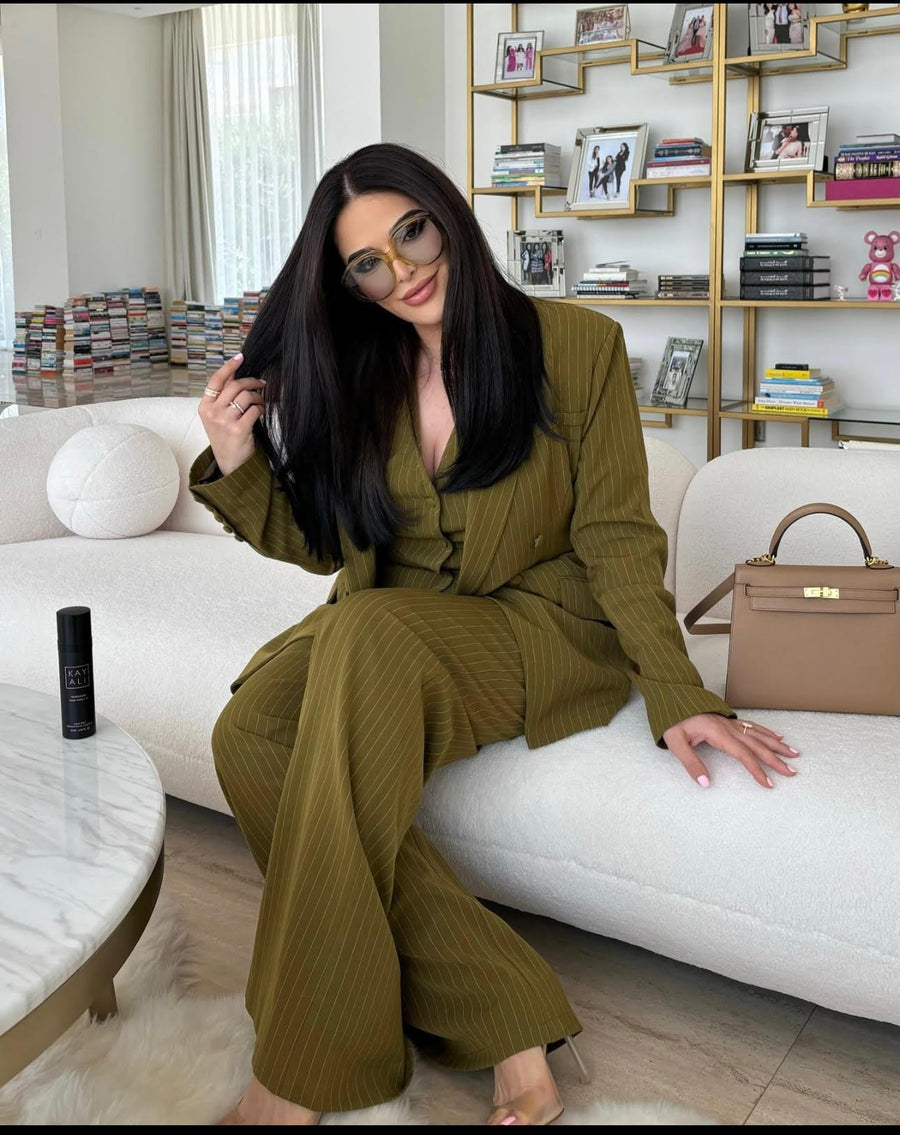 ALALYA Verde Linea™ tailored olive green 3-piece women's suit set – Lifestyle Setting – UAE