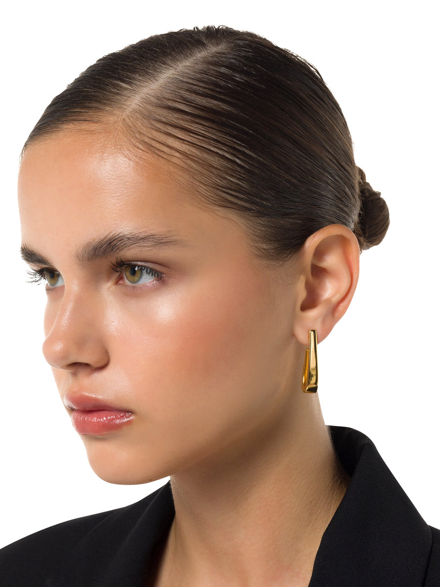 Gilded Serenity 18ct gold sculptural hoop earrings worn – ALALYA Dubai