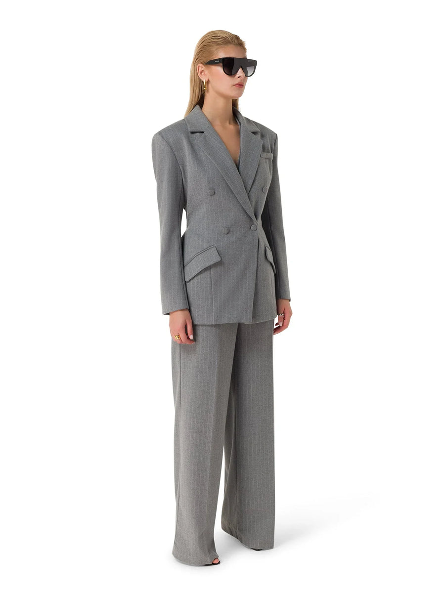 Side profile of Maison Grise™ tailored 3-piece suit set showcasing fit and fabric drape