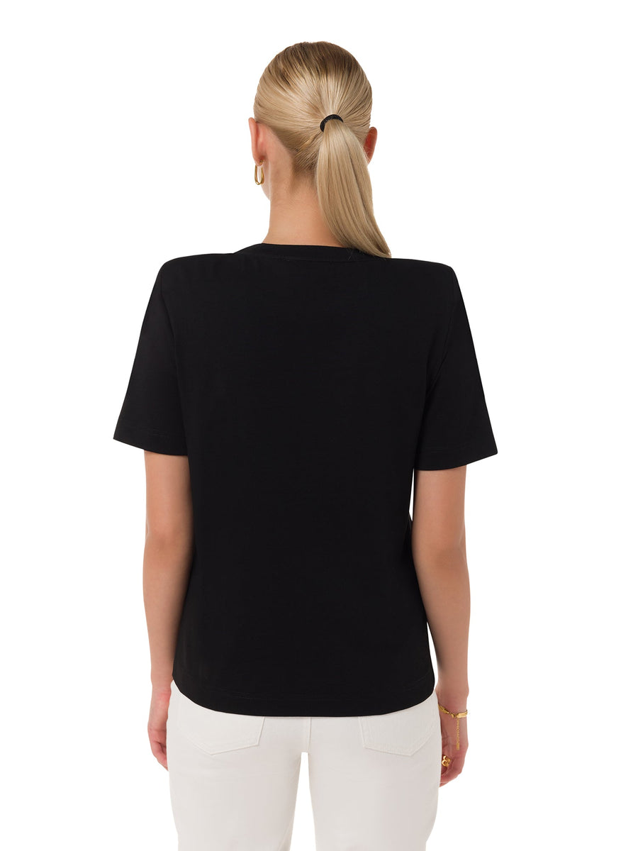 Flatlay of black cotton padded shoulder tee – ALALYA GCC


