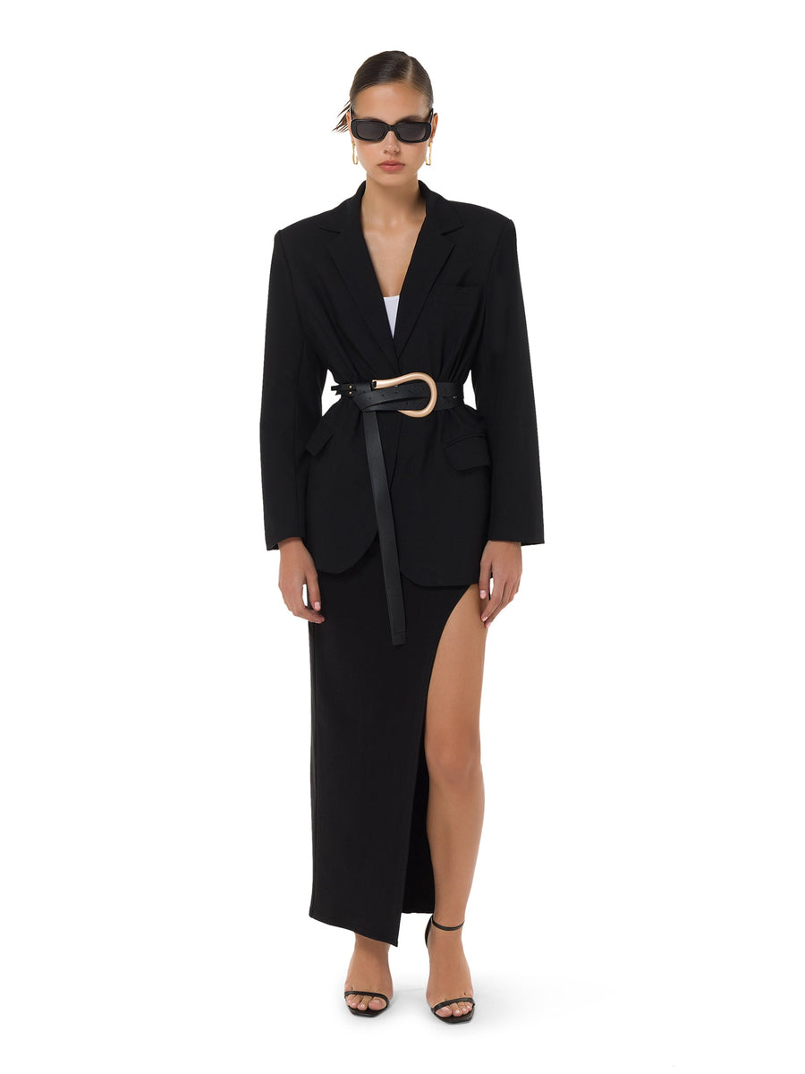 Elegant high-waist black slit maxi skirt styled view – ALALYA UAE